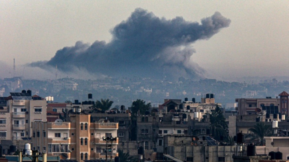 Smoke rises over Khan Yunis in the southern Gaza Strip during Israeli bombardment on December 20, 2023