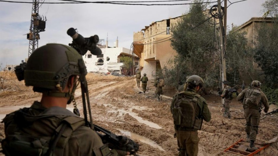 This handout picture released by the Israeli army on December 24, 2023 reportedly shows Israeli soldiers from the Givati Brigade operating in Khan Yunis in the southern Gaza Strip 