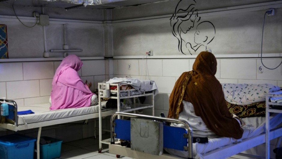 Afghan women sit beside their newborns at the Doctors Without Borders (MSF)-run maternity hospital in Khost