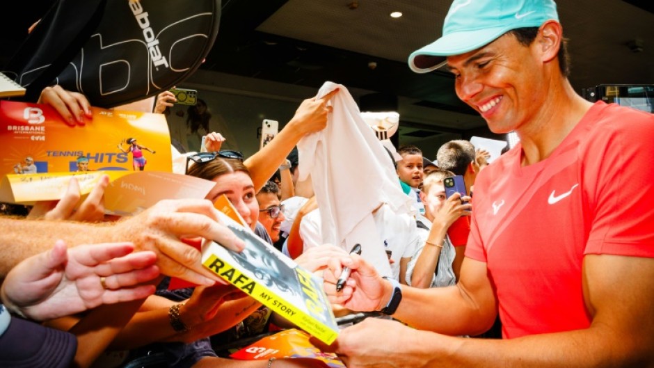 Spain's Rafael Nadal signs autographs during a promotional event ahead of the Brisbane International