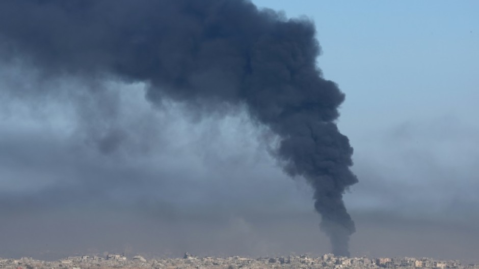Smoke billows over the Gaza Strip on Friday amid continuing battles between Israel and the militant group Hamas