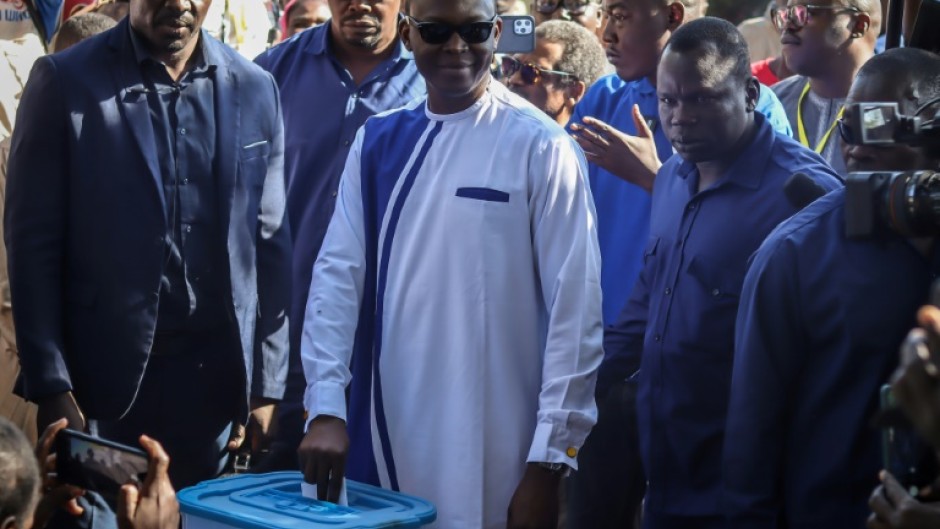 Chad's former opposition leader Succes Masra (C) returned from exile in November after reaching an accord with the military leaders