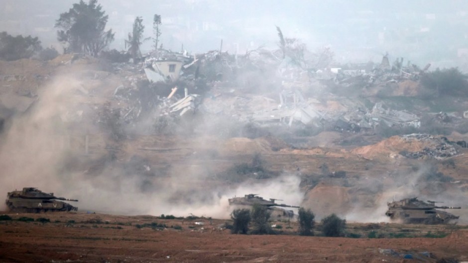 Israeli tanks roll through the central Gaza Strip on Tuesday