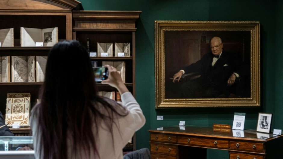 Winston Churchill’s personal desk and a portrait of the late British leader by Arthur Pan, part of the Winston S. Churchill Collection Of Steve Forbes, at the Winter Show in New York City on January 18, 2024