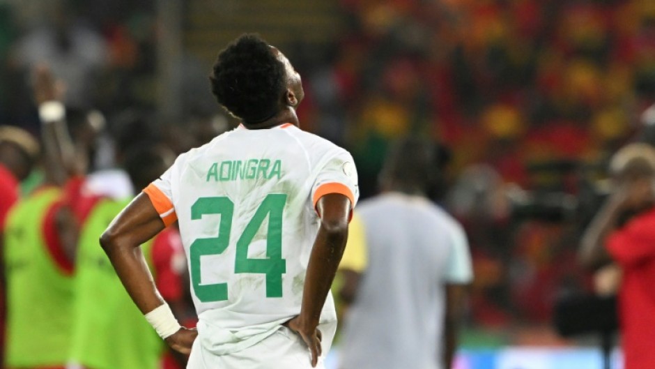 Ivory Coast forward Simon Adingra appears dejected at the end of his team's humiliating 4-0 loss to Equatorial Guinea on Monday