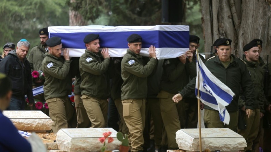 Israeli troops carry the coffin of fellow soldier Hadar Kapeluk during his funeral in the Mount Herzl cemetery in Jerusalem