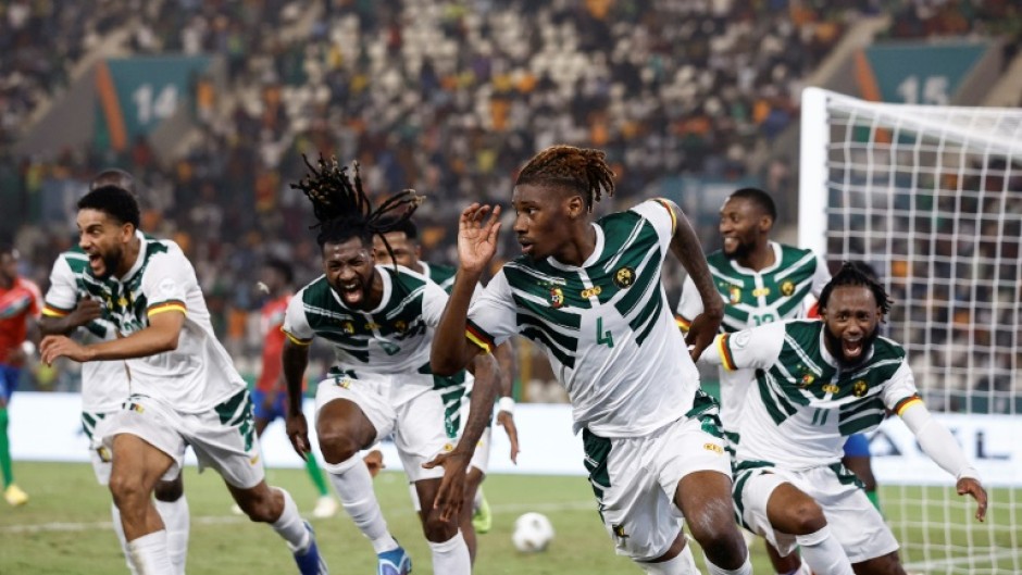 Christopher Wooh (3R) celebrates after scoring the winning goal for Cameroon against Gambia.
