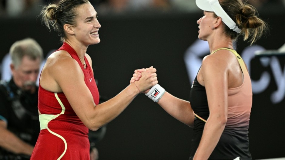 Aryna Sabalenka (L) shakes hands with Barbora Krejcikova after beating her in the Australian Open  quarter-finals