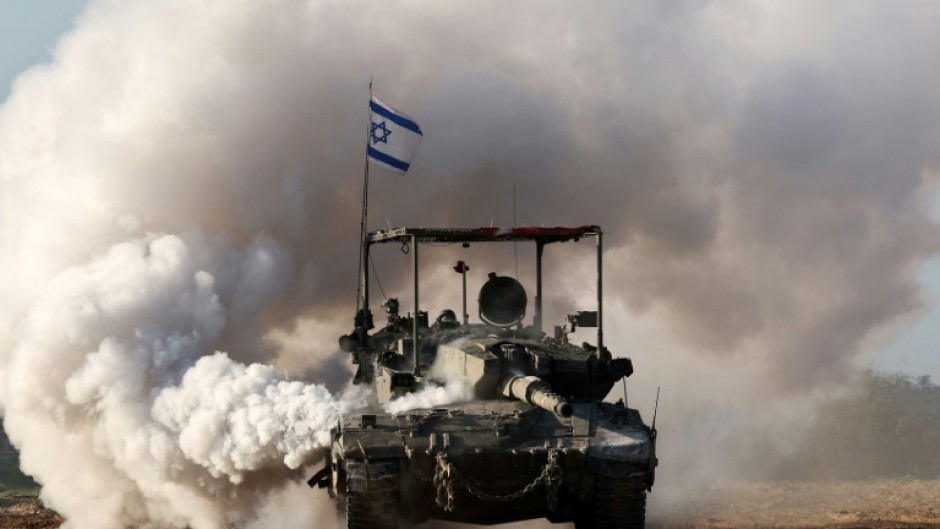 An Israeli army tank is seen in southern Israel along the border with the Gaza Strip