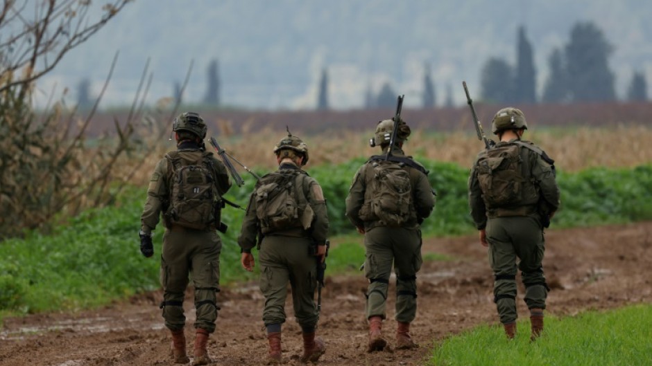 Israeli soldiers patrol an area close to the border with Lebanon after Hezbollah said it carried out a drone attack