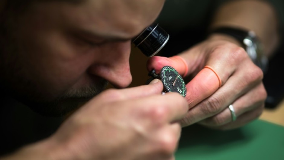 ID Geneve brand co-founder Cedric Mulhauser works on a watch movement