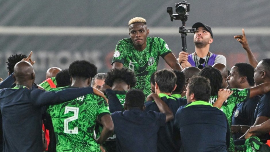Victor Osimhen (C) and teammates celebrate after Nigeria reached the Africa Cup of Nations final.
