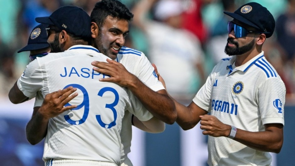 India's Ravichandran Ashwin celebrates after taking his 500th wicket, that of England's Zak Crawley, during the second day of the third cricket Test in Rajkot