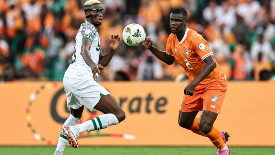Victor Osimhen (L) in action for Nigeria against hosts Ivory Coast during the group stage