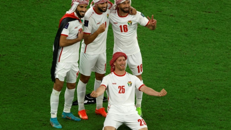 Jordan's players celebrate after defeating South Korea 