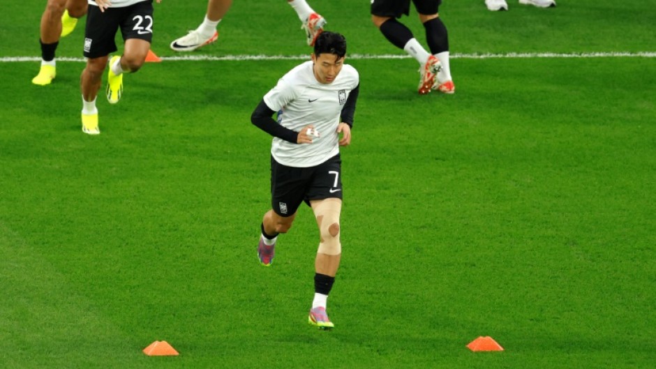 Captain Son Heung-min, his fingers bandaged, warms up ahead of South Korea's semifinal loss to Jordan at the Asian Cup