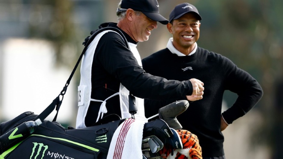 Golf superstar Tiger Woods enjoys a laugh with his caddie Lance Bennett during the pre-tournament pro-am at the US PGA Tour Genesis Invitational at The Riviera Country Club