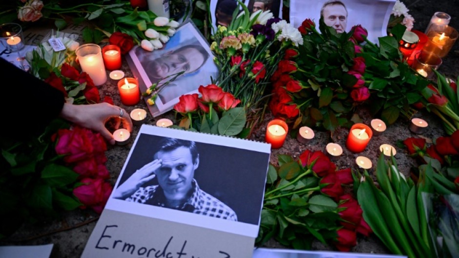 Flowers and candles left at a memorial to Navalny outside the Russian embassy in Berlin