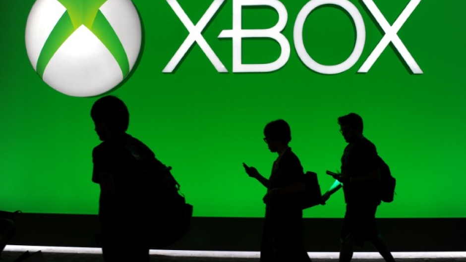The head of Microsoft's Xbox team says it is not changing its 'fundamental' strategy of exclusive video games but wants to reach as many players as possible with strategic decisions
