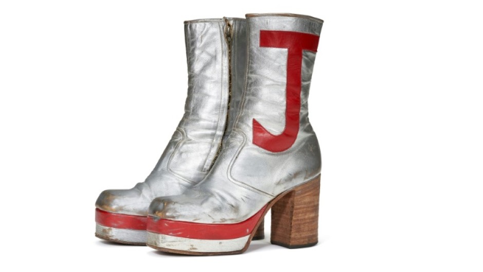 Elton John's monogrammed silver leather boots sold for nearly $100,00 at auction in New York