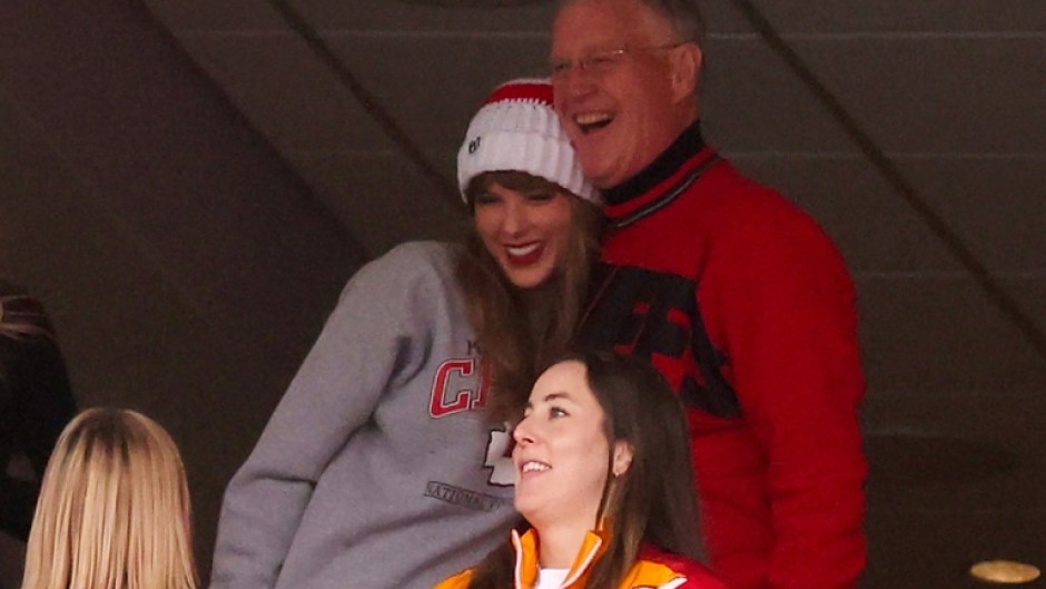 Scott Swift (top R), seen taking in an American football game with daughter Taylor Swift (L), is accused of punching a photographer
