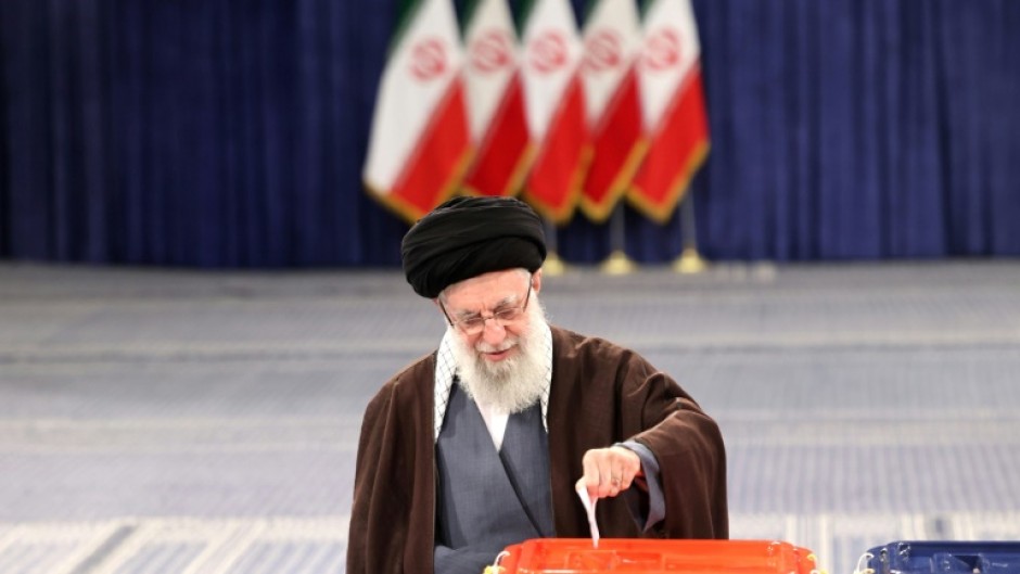 Supreme leader Ayatollah Ali Khamenei casts his ballot, appealing for citizens to do the same because Iran's 'enemies want to see if the people are present'