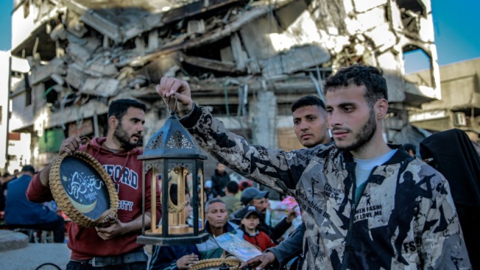 A man chooses a Ramadan lantern in Gaza City amid the ongoing conflict between Israel and Hamas militants