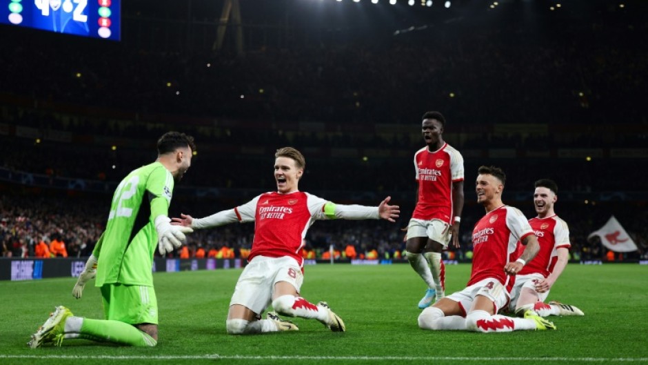Arsenal celebrate their penalty shootout win over Porto in the Champions League last 16