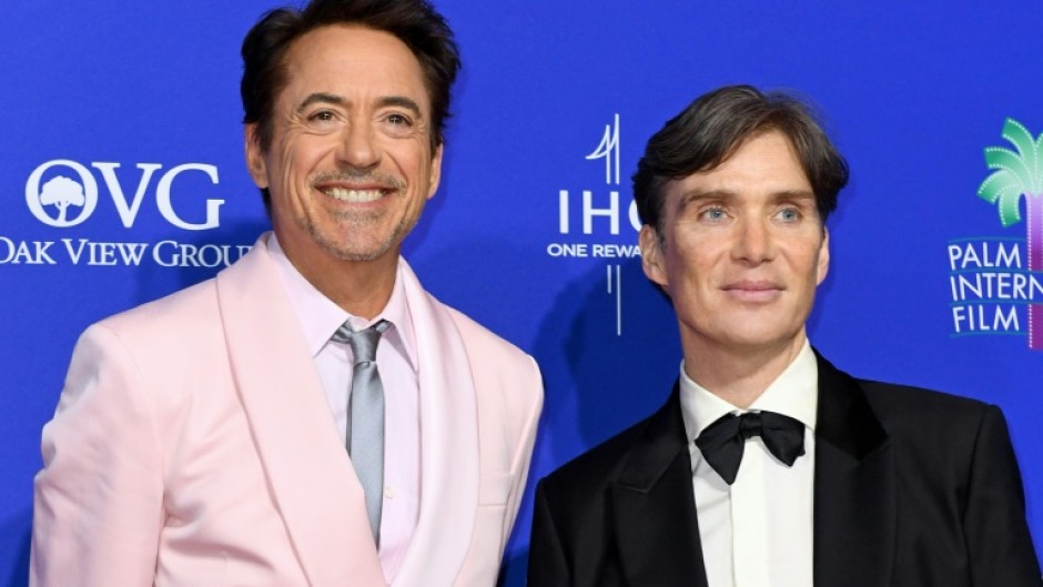 Oppenheimer stars Cillian Murphy (R) Robert Downey Jr. are contenders for the Academy Awards Sunday