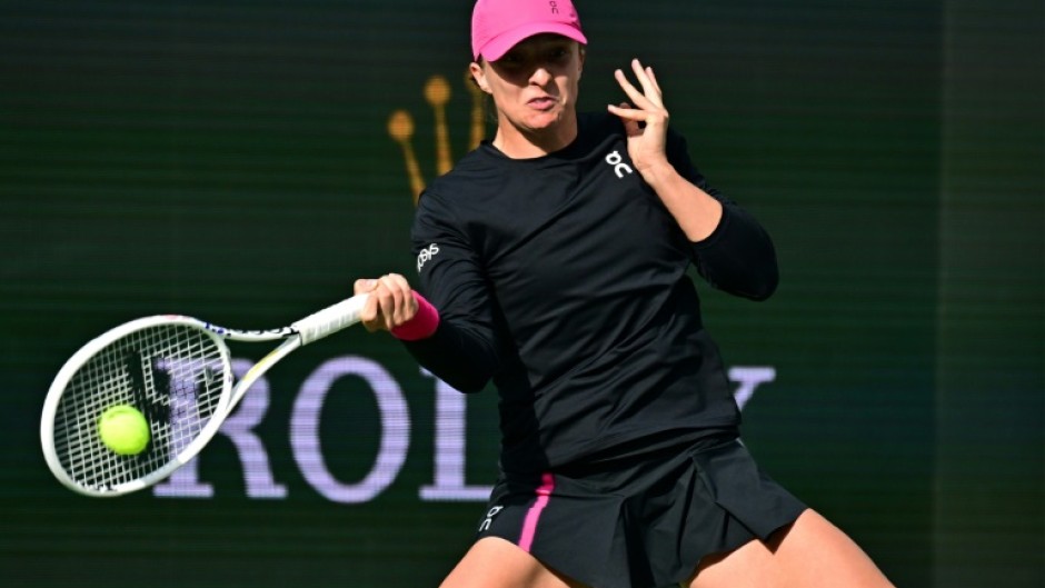 World number one Iga Swiatek belts a forehand on the way to her semi-final victory over Marta Kostyuk in the ATP-WTA Indian Wells Masters