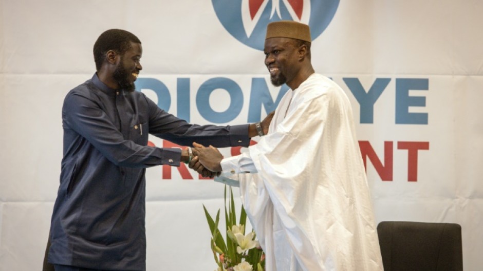 Ousmane Sonko (R) and Bassirou Diomaye Faye (L) during a press conference in Dakar on March 15, 2024