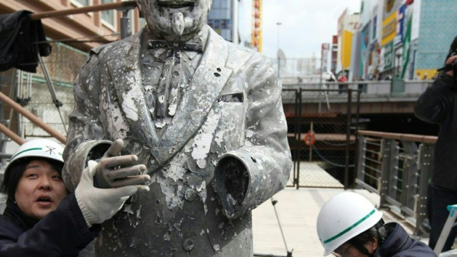 A statue of Colonel Sanders after it was recovered from the sludge of a river in Osaka, Japan on March 11, 2009