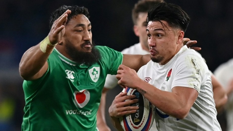 Bundee Aki (L) tackles Marcus Smith during Ireland's narrow defeat by England at Twickenham in the Six Nations