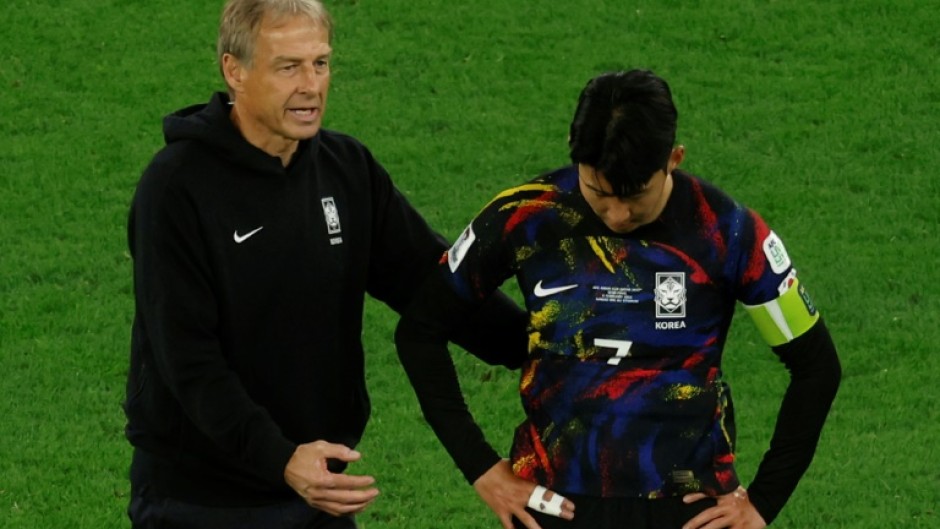 Jurgen Klinsmann and Son Heung-min after a defeat in Qatar
