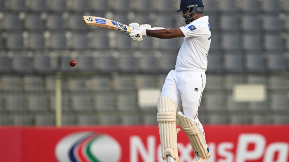 Sri Lanka's Dimuth Karunaratne held firm to score 52 off 101 balls before his dismissal off Shoriful Islam in the day's final session