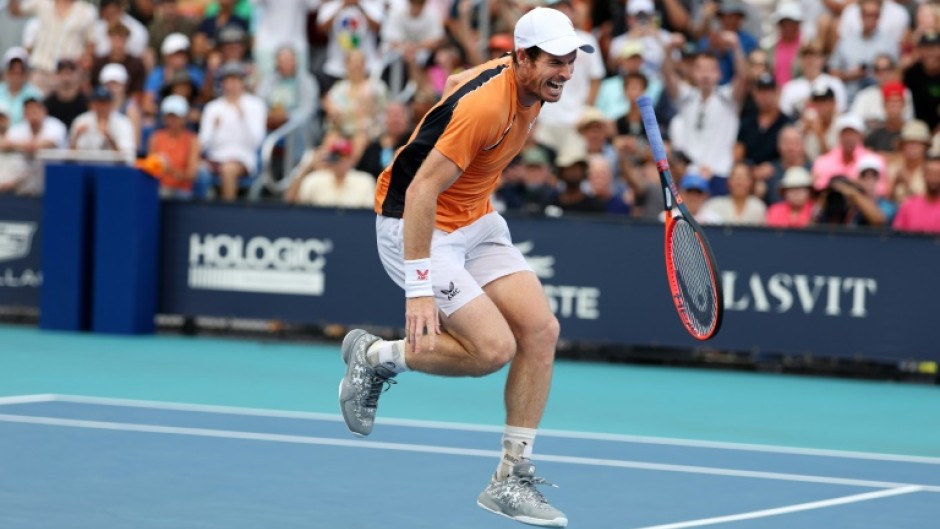 Andy Murray of Great Britain screams in pain after hurting his left ankle during his match against Tomas Machac of the Czech Republic on Day 9 of the Miami Open at Hard Rock Stadium on Sunday.