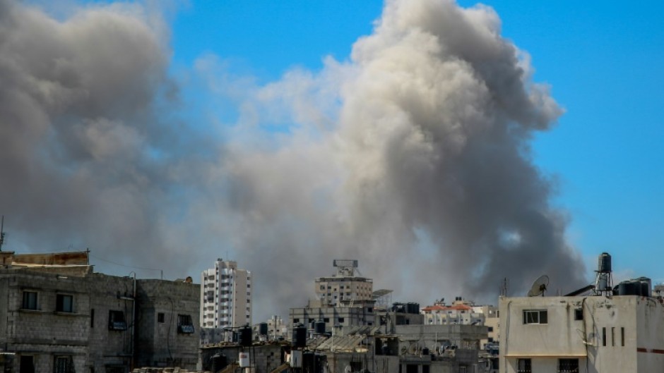 Smoke billows after Israeli bombardment in the vicinity of the Al-Shifa hospital in Gaza City on March 23, 2024