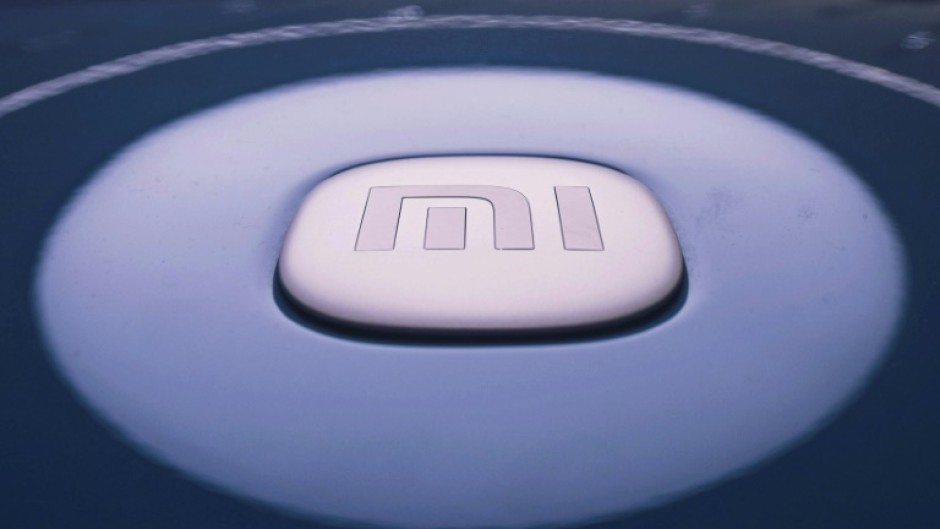 Xiaomi's logo featured on its new SU7 EV model at a shop in Hangzhou
