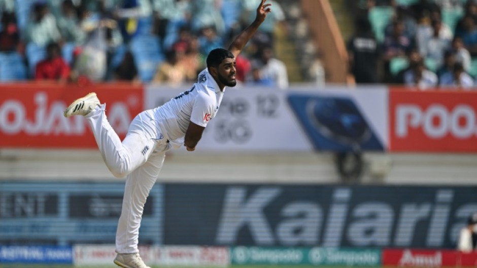 Relaxed over home debut: England leg-spinner Rehan Ahmed pictured bowling in the third Test against India at Rajkot in February 
