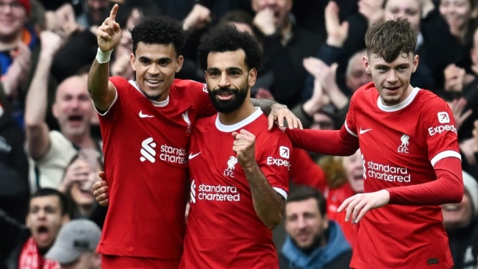 Liverpool's Mohamed Salah (C) celebrates after against Brighton