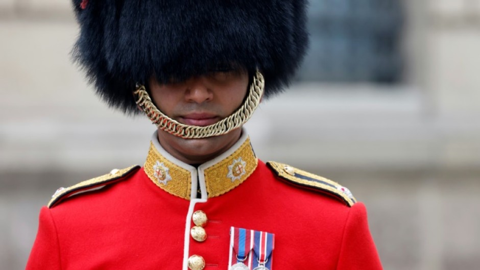 A British member of the Coldstream Guards outside the Elysee Palace in Paris
