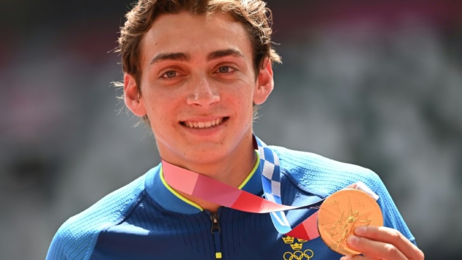 Olympic pole vault champion Armand Duplantis, pictured with his gold medal from the 2020 Tokyo Games, will receive $50,000 if he wins in Paris this year

ce celebrates on the podium with his gold medal after competing in the men's pole vault event during the Tokyo 2020 Olympic Games at the Olympic Stadium in Tokyo on August 4, 2021.
