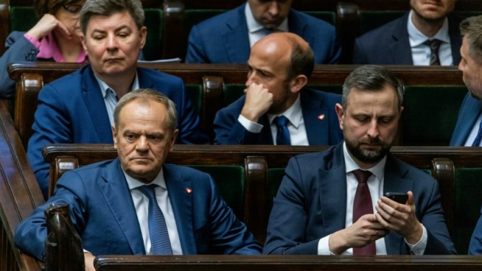 The hotly-anticipated vote was a test for the governing alliance of Polish Prime Minister Donald Tusk (L),
as some coalition lawmakers were reluctant to back the legislation