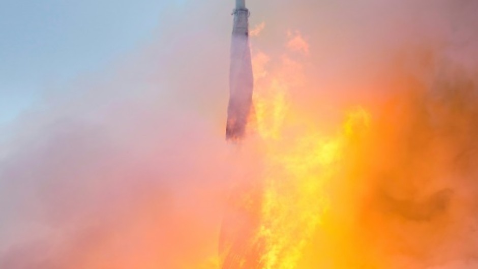 The spire disappeared in flames