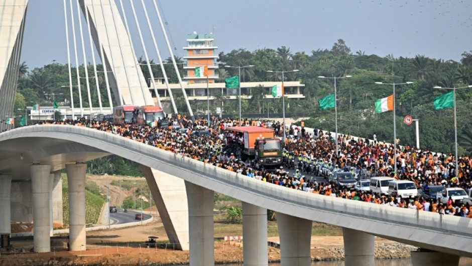 The Ivory Coast team, winners of the 2024 African Cup of Nations (CAN), and supporters on the Alassane Ouattara bridge in Abidjan in February