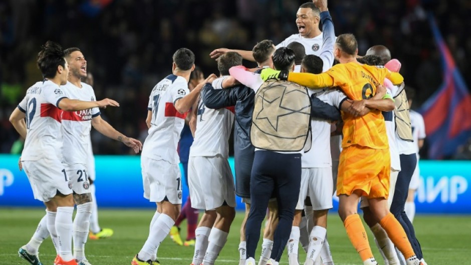 Kylian Mbappe and his teammates celebrate after Paris Saint-Germain beat Barcelona to reach the Champions League semi-finals