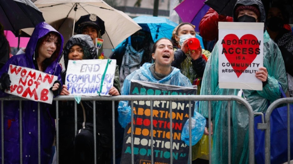 Pro abortion rights activists hold placards during the annual anti-abortion demonstration in New York City, on March 23, 2024