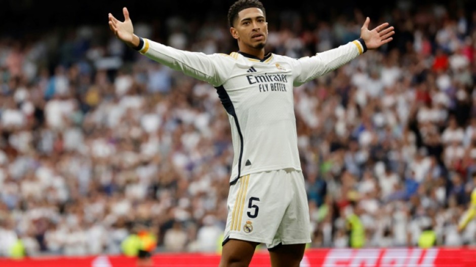 Real Madrid's English midfielder Jude Bellingham celebrates scoring against Cadiz as his team stormed towards the title