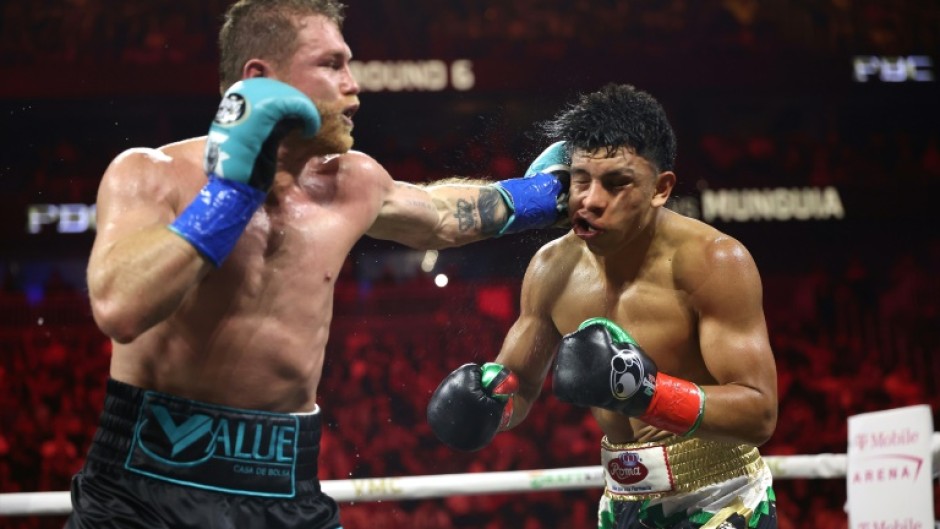 Saul 'Canelo' Alvarez lands a left against Jaime Munguia on the way to a unanimous decision victory in their super-middleweight world title fight in Las Vegas