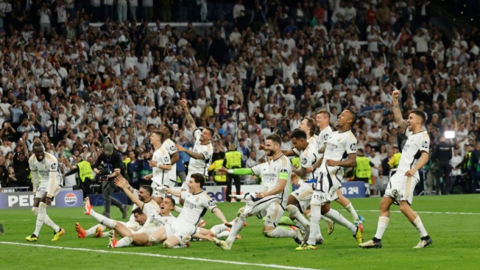 Real Madrid's players celebrate victory at the end of the Champions League semi-final second leg against Bayern Munich